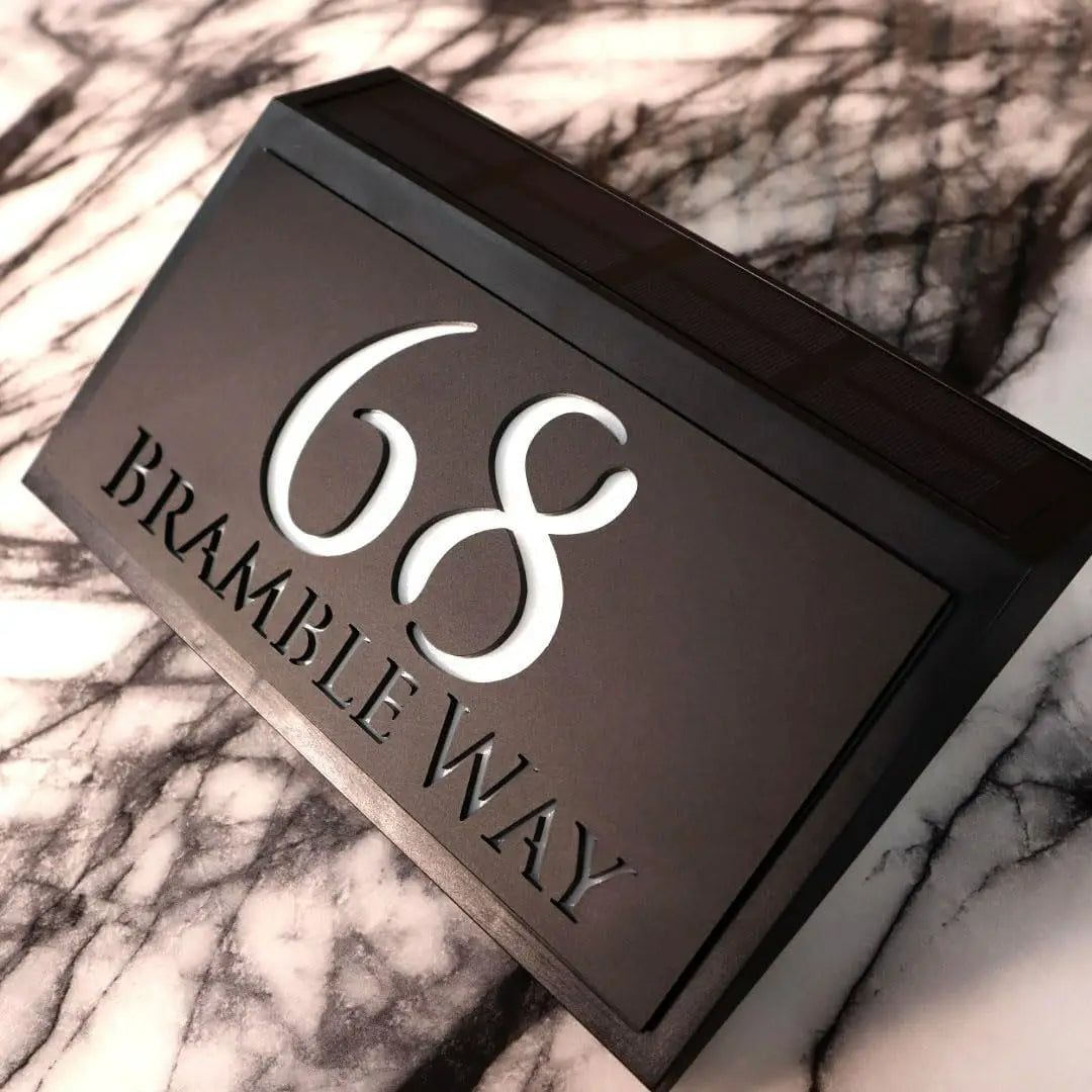 Modern solar-powered custom acrylic house sign with address number and street name on black background