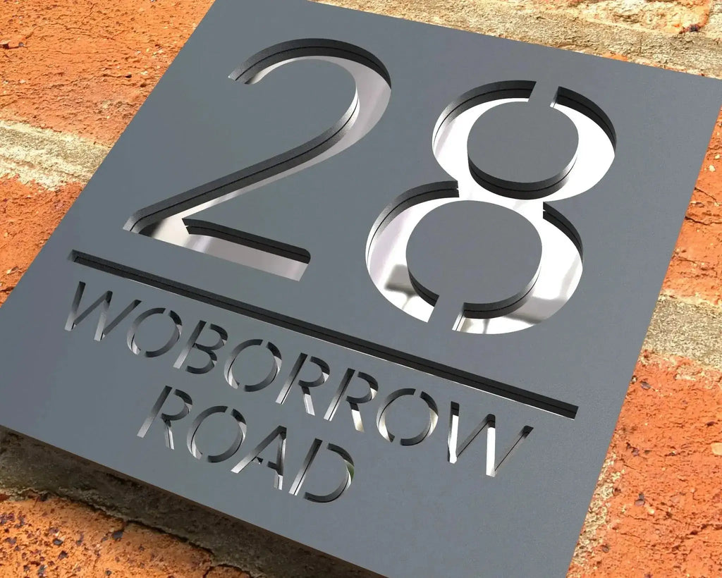 Custom square acrylic house number and street name sign mounted on brick wall with modern cut-out design