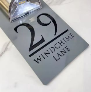 Custom rectangular acrylic house number sign with solar light and engraved address Windchime Lane 29