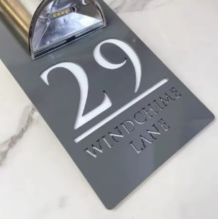 Rectangular custom acrylic house sign with solar light, engraved address number 29 and Windchime Lane text