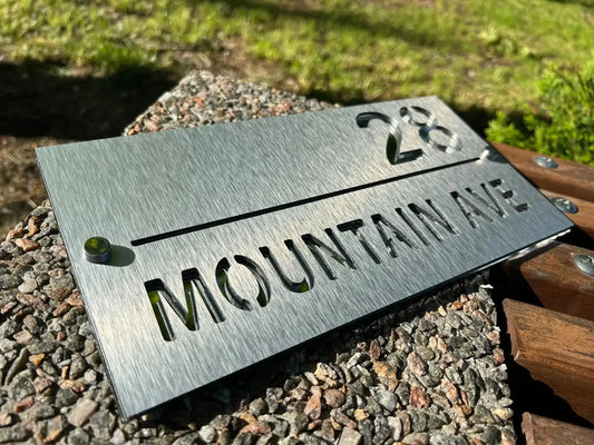 Custom stainless steel address sign with brushed finish showing number 28 and Mountain Ave text.