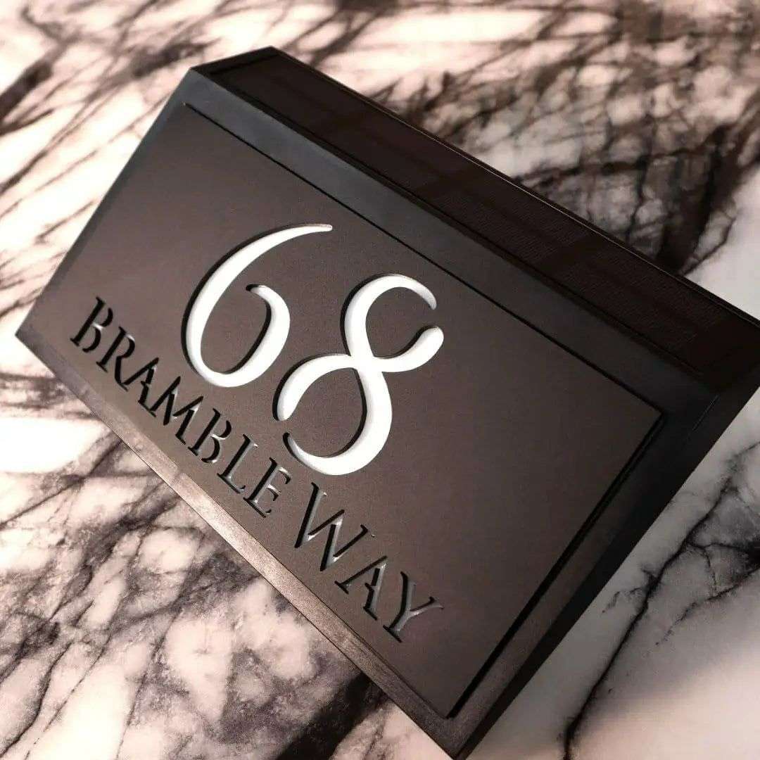 Modern solar-powered acrylic house sign with custom laser-etched address and dusk sensor for outdoor use